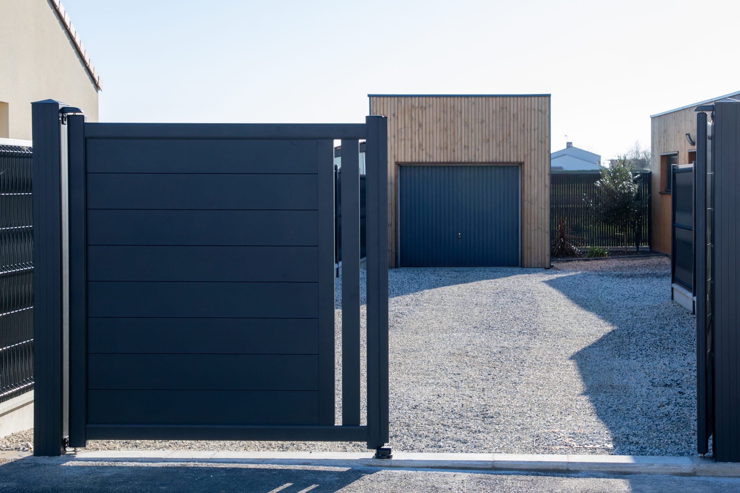 open-grey-double-portal-large-metal-gate-high-gray-suburb-street-house-garage-door open grey double portal large metal gate high gray on suburb street house garage door